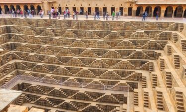 Tourist are watching Chand Baori with our Guide.