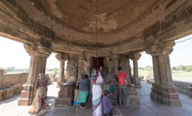 local people visiting Harshat Mata temple next to the Chand Baori in Abhaneri, consisting of three large stepped terraces, dating from the ninth or tenth centuries.